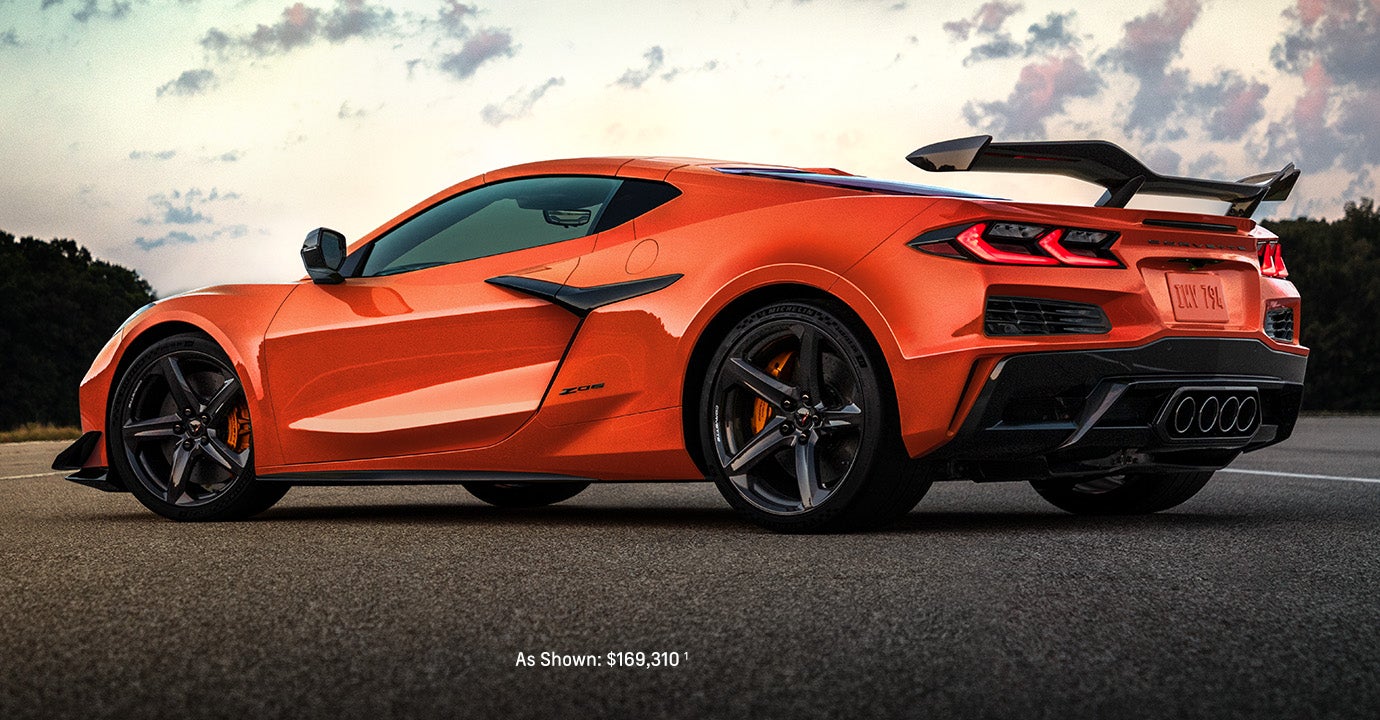 Orange Chevrolet Corvette Z06 on a road.